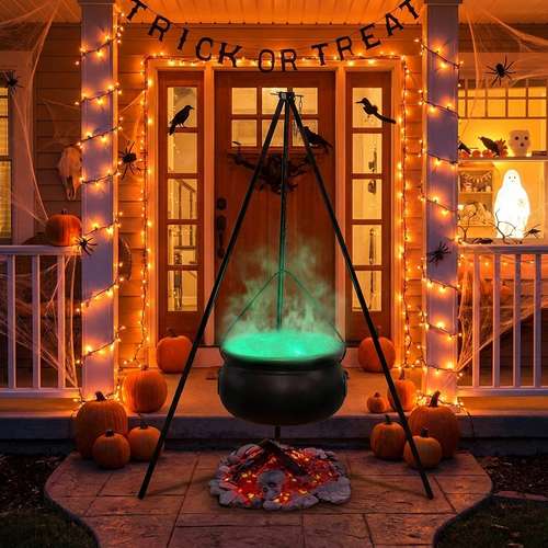 Bubbling cauldron prop with fog effect at a front doorway